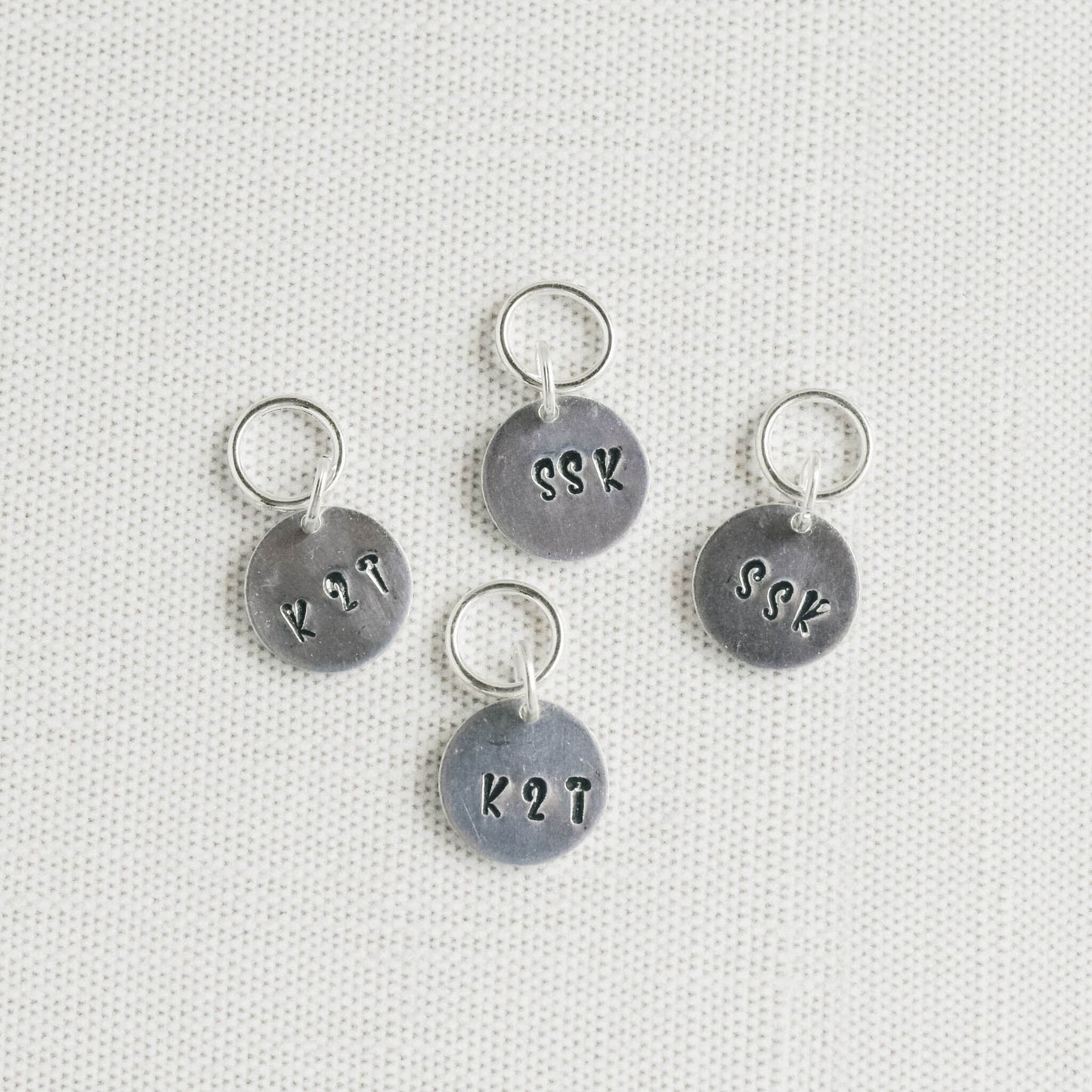 Set of 4 Hand Stamped Stitch Markers - SSK and K2TOG