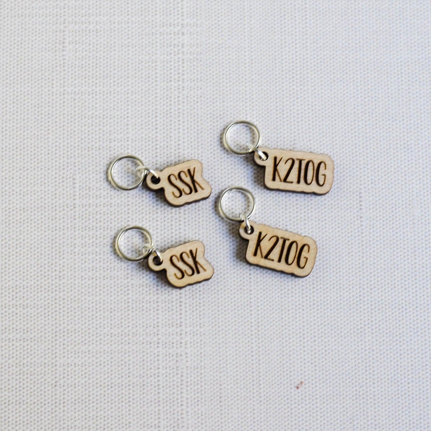 Set of 4 laser engraved Stitch Markers - SSK and K2TOG - Birch Outline